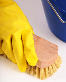 Person scrubbing surface, close-up, elevated view